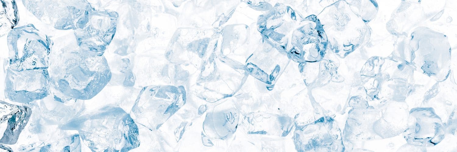 Close up, top view of ice cubes floating on water
